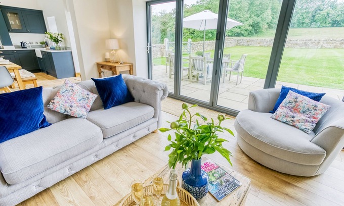 Bodorgan Cottage | Carrog Barn - a ground floor bedroom that sleeps 6 guests in 3 bedrooms