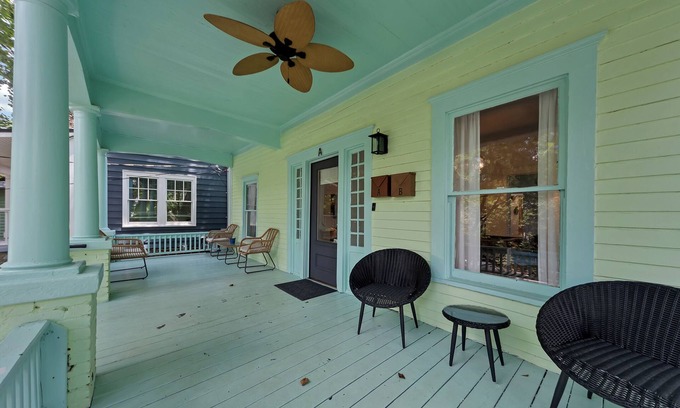 Inman Park Apartment | Charming 2BR/2BA lower-level unit in a classic Inman Park duplex. Features full kitchen, cozy living area with fireplace, Southern-style front porch, clawfoot tub, in-unit laundry, and dedicated parking. Walkable to dining and MARTA.