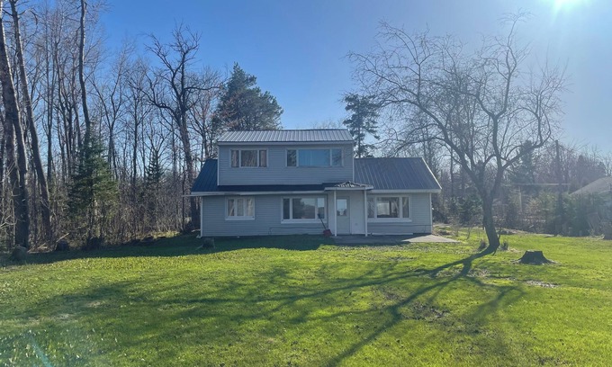 Sault Ste. Marie House | Charming house on the St. Mary's river in Sault Ste. Marie, freighters out front