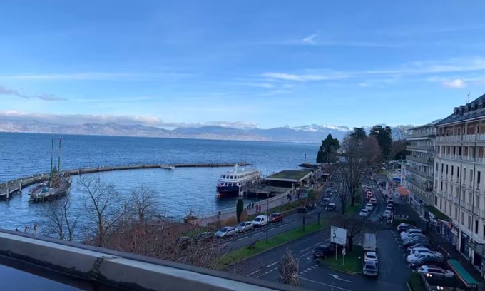 Evian-les-Bains Apartment | Charming little studio with lake and mountain views from the bed.