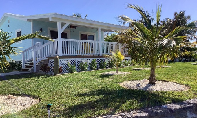 Williams Town Apartment | Charming New Blue Studio on water with dock, WiFi & AC in fun time Freeport