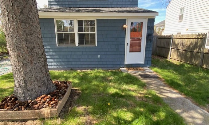 Riverhead House | Charming Riverhead home with large outdoor patio & backyard firepit
