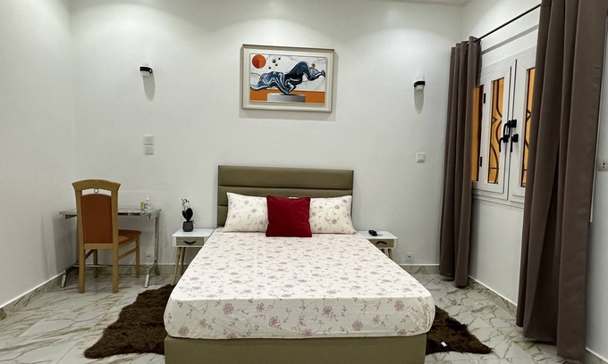 Point E Apartment | Chic apartment with a cute little garden. 30 minutes from the AIBD airport