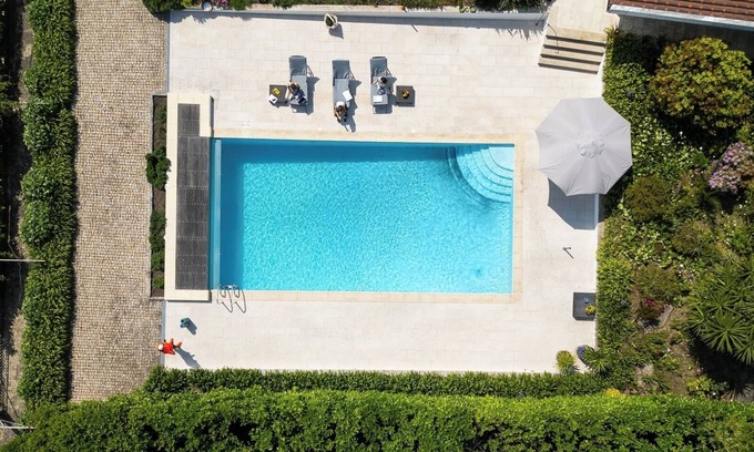 Paredes House | Classic Villa w/Gym and Pool Access by HostWise