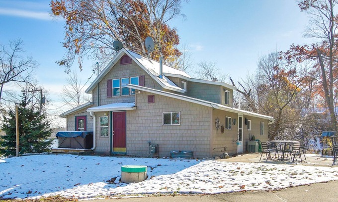 Campbellsport Cottage | Colorful Cottage w/Hot Tub - Steps to Long Lake!