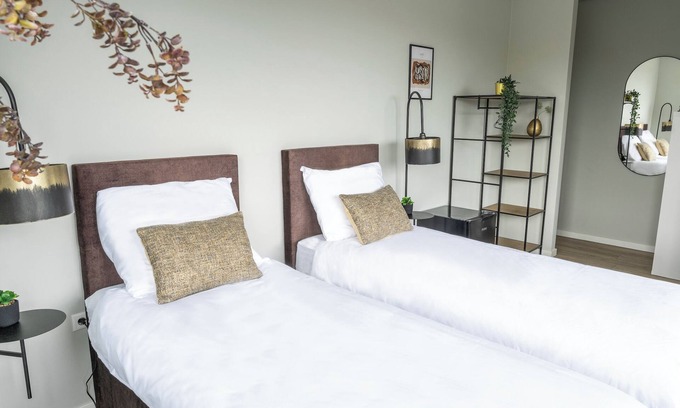 Raamsdonksveer Apartment | Combined rooms, 12 beds, kitchen, and free parking