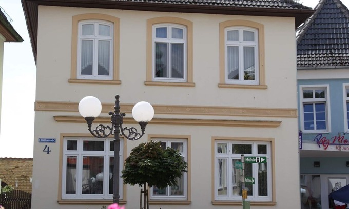 Kappeln Apartment | Cozy 4-star vacation apartment on the top floor with a beautiful view of the St. Nikolai Church in Kappeln and its own terrace in the garden
