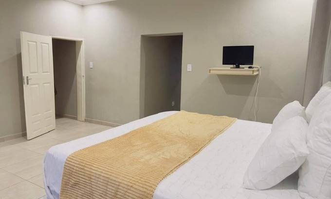 Matsapha House | Cozy bedroom ensuite, fully equipped retreat.