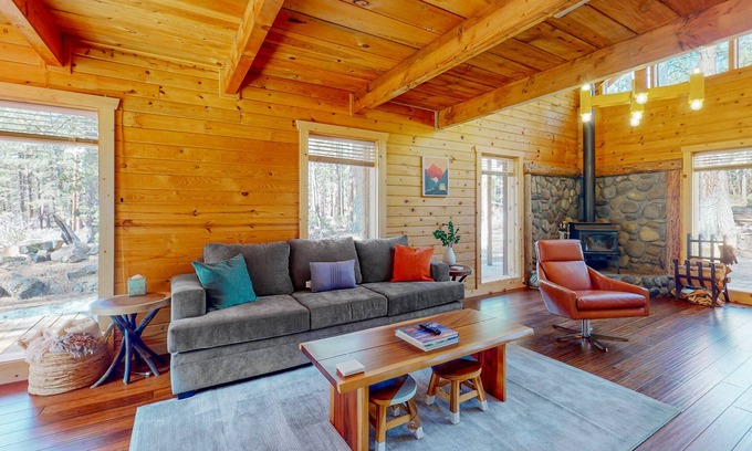 River Forest Acres Cabin | Cozy & colorful retreat with a deck, grill, wood stove, board games, W/D, & AC