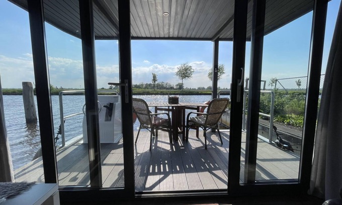 Steenwijk Boat Rental | Cozy Houseboat in Steenwijk near Giethoorn