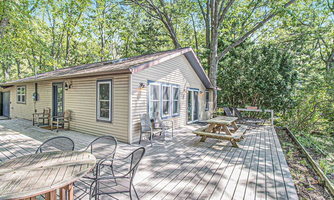 Allegan Cottage | Cozy, lakefront cabin with gas grill and wrap-around deck.