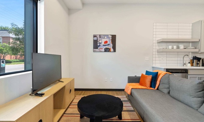 Lockerbie Square Apartment | CozySuites Mass with parking, lounge and roof deck 1