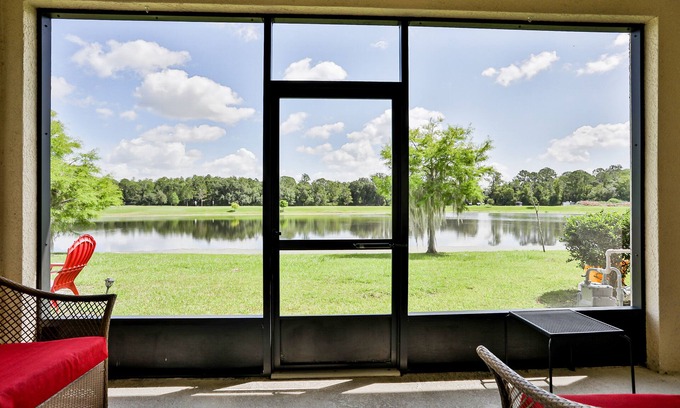 Trafalgar Village House | Delightful lakefront townhome with pool, volleyball, fast WiFi & AC