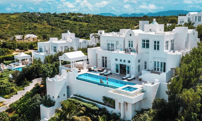 Long Bay Village Villa | Deluxe white 5 bedroom villa with sea view