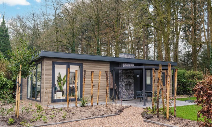 Lieren House | Enjoy a luxury holiday home in the wooded nature of the Veluwe, featuring modern amenities, air conditioning, and a stylish pergola for optimal comfort.