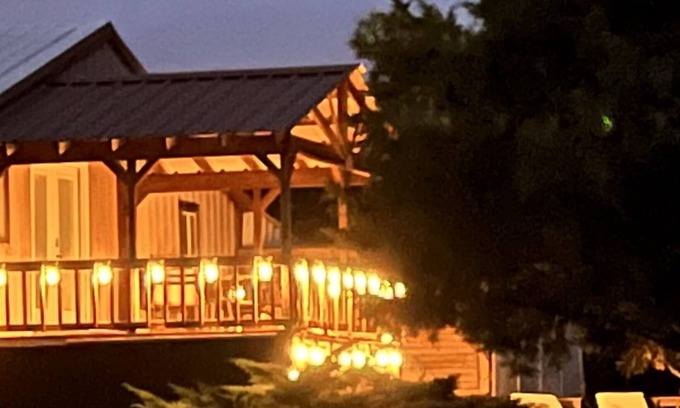 Edmond Cabin | Enjoy our loft with a private hot tub overlooking the vineyard and pond.