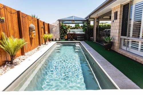 Beerwah House | Entertainer's Paradise! Child & pet friendly Pool spa, movie room - close to Australia Zoo