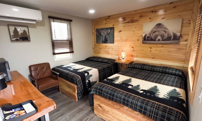 North Greece Hotel | Escape to the tranquility of our cozy cabin inn, where rustic charm meets modern comfort. Experience a home away from home ambiance.