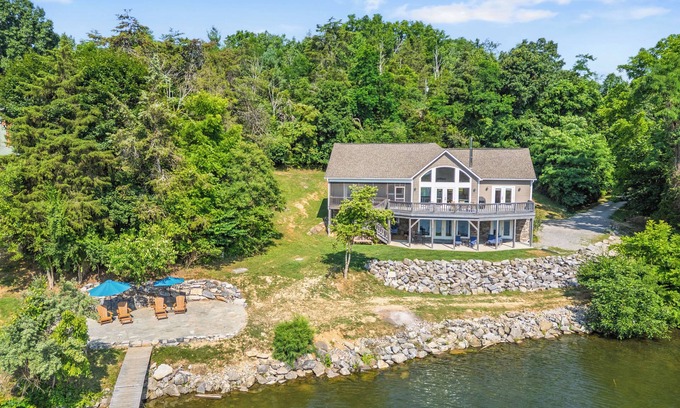 Pulaski House | Experience the perfect blend of rustic charm and modern luxury in this Claytor lakefront retreat