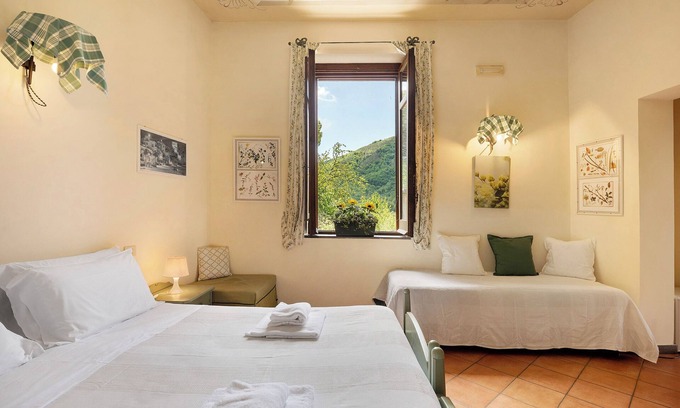Fisciano Apartment | Farmhouse 'Camera Quadrupla Con Vista Giardino' with Mountain View, Wi-Fi and Air Conditioning