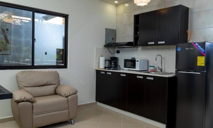 Alto Boquete House | First floor room with small living room and kitchenette