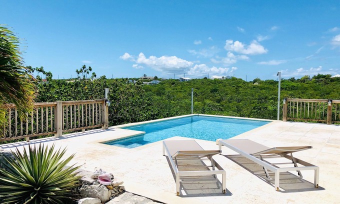 Long Bay Cottage | Flame Tree Cottage. Private home with pool and ocean view. 1/2 mile to beach