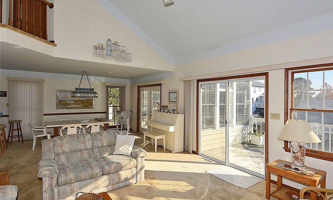 Sandpiper Pines House | FREE DAILY ACTIVITIES! Lovely 4 bedroom + Den, (Two Master Bedrooms) 3.5 bath home, located on the canal, with boat dock, 2 car garage,just a short walk to the lifequarded beach.