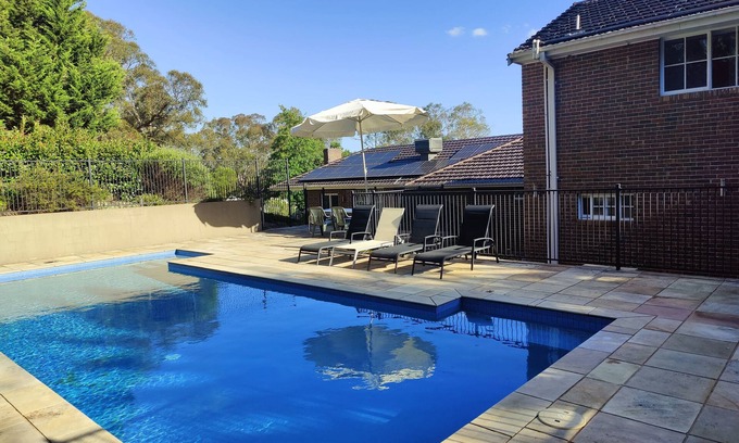 Eltham House | Gorgeous 4-Bedroom Home & Venue on a Mansion - an acre land with Pool & Garden n