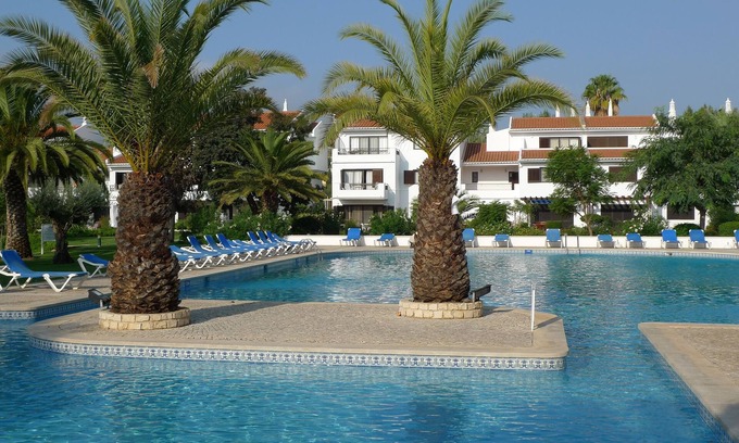 Almancil Apartment | Ground Floor Apartment in Lakeside Village overlooking lake, pool and gardens.