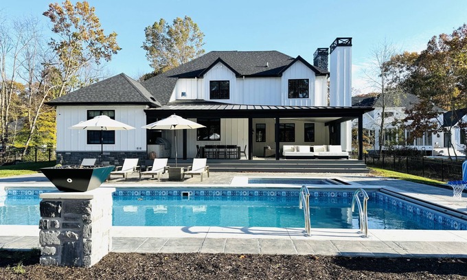 Grand Beach House | Heated pool, porch w/fireplace, close to beach & park, 6 per golf cart included