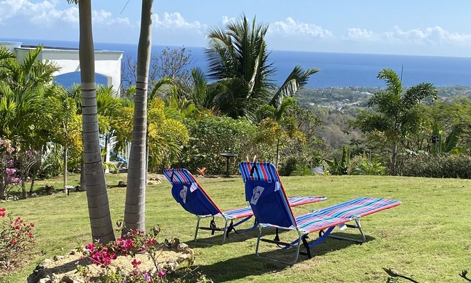 Lucea Apartment | Hilltop Studio with ocean views, free daily breakfast and airport pickup.