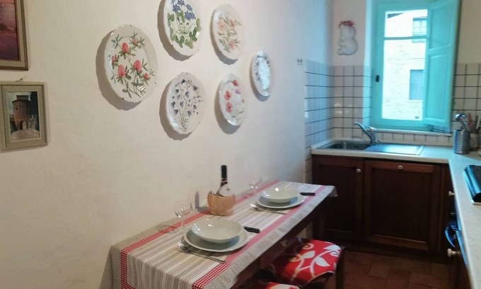 San Quirico d'Orcia Apartment | Historic residence at the well
