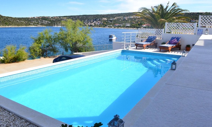 Sevid House | Holiday beach house with private heated pool and buoy