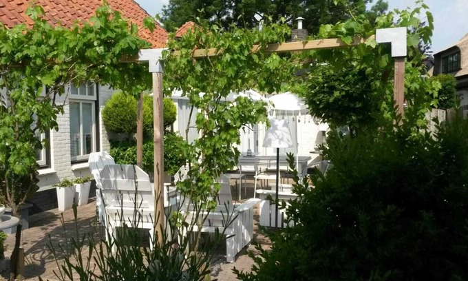 Hoogwoud House | Holiday Home “Engel van de Molen” for Couples with Terrace, Garden & Wi-Fi