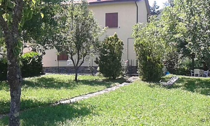 Ponte della Venturina House | Holiday home with panoramic garden near the lake Suviana