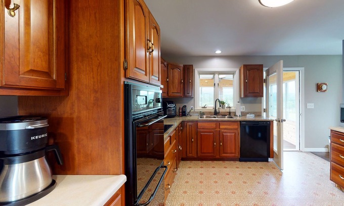 South Burlington House | Home with mountain views, large yard, fire pit, deck & 3-season room