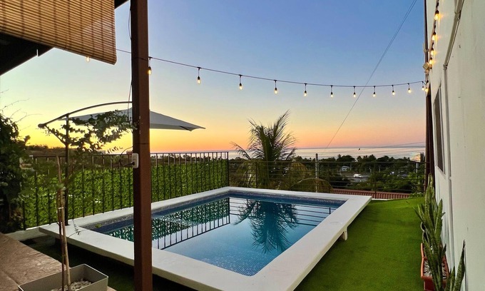 Santa Tecla House | house with a beautiful sea view in enchanting SurfCity with WiFi, AC and Pool.