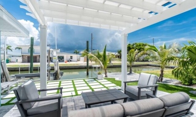 Englewood House | Island charm meets waterfront adventure! Private dock on a deep-water canal with quick Gulf access