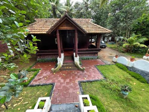 Poovar House | Kerala Heritage Home - Periya Veedu