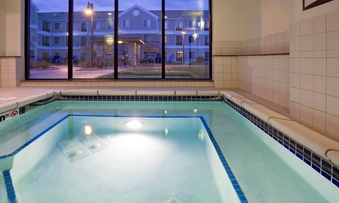 Oconomowoc Condo | King Suite. Free Breakfast. Pool. Gym. Near Aurora Medical Center!
