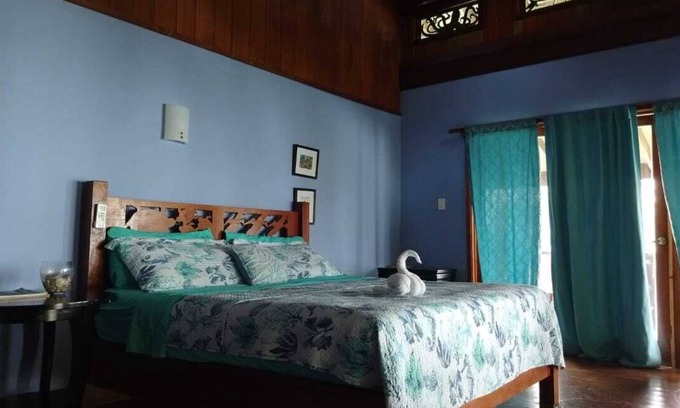 Carenero Island Bed & Breakfast | King Suite Ocean and Jungle View wrap around private balcony