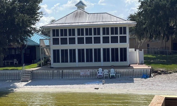 Babson Park House | Lakefront home with white sand beach and private boat dock on Crooked Lake.