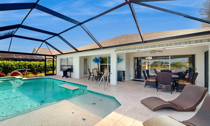 Beachwalk Isles House | Lakefront home with private heated outdoor pool, enclosed lanai, & central AC
