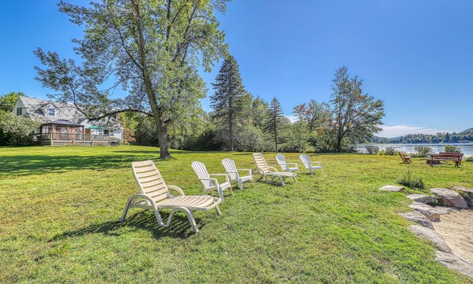 Brant Lake House | Lakefront house with 275' of waterfront, enclosed porch, & firepit
