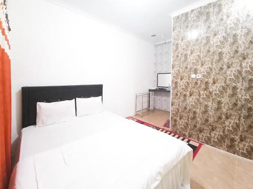Oro Oro Ombo Hotel | Lancar Homestay Syariah near BNS Mitra RedDoorz
