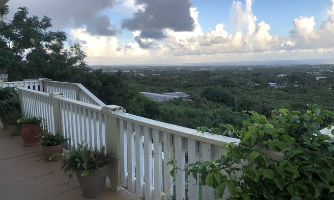 Estate Whim House | Large hillside one bedroom apartment with a sea view.