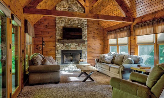 Cedarhurst Cabin | Log Cabin with living room fireplace and hot tub