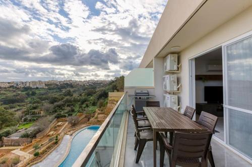 Xaghra Apartment | Lovely home with beautiful view with communal pool by 360 Estates