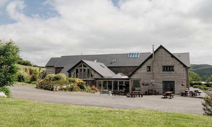 Devils Bridge House | Luxury renovated barn + countryside farmhouse with large hot tub sleeping 50