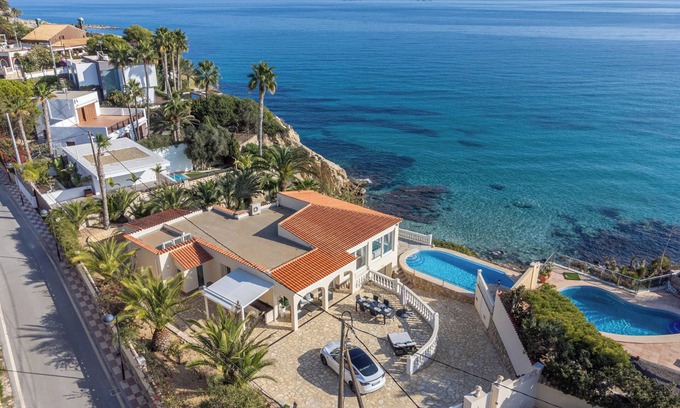 Coveta Fuma House | Luxury villa with its own swimming pool, directly by the sea, stairs to the see.